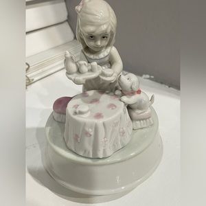 Porcelain girl serving tea with dog